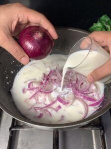 Adding shallot and pouring milk 4K 20260918084501